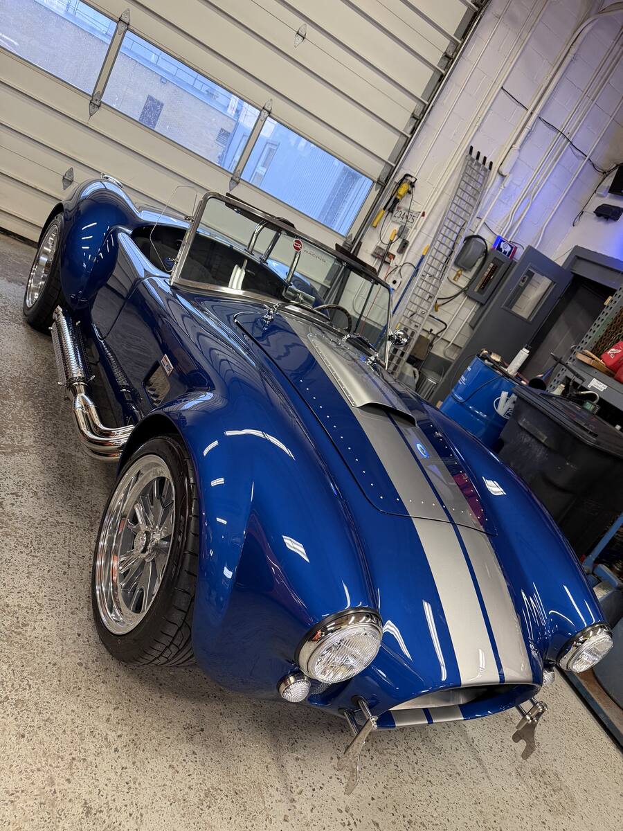 Detailed blue Shelby Cobra with white stripes