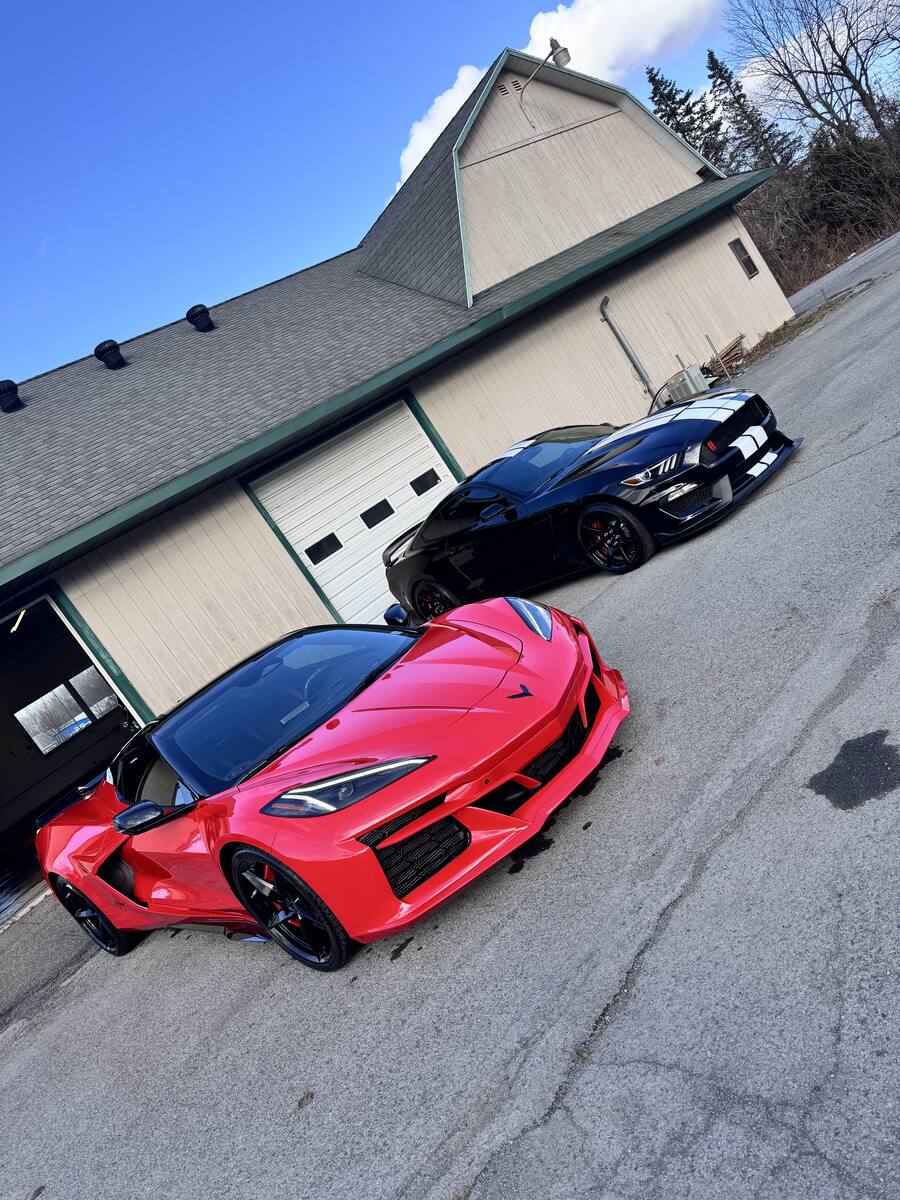 Detailed red Corvette and black Shelby GT500