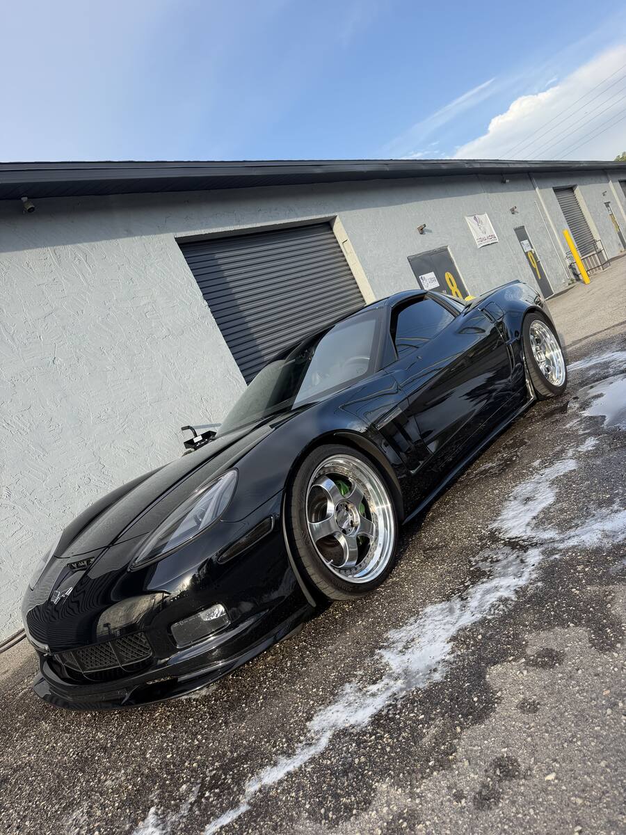 Detailed black Corvette with chrome wheels