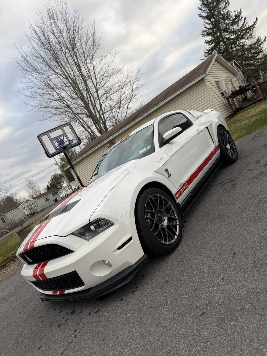 Detailed white Ford Mustang Shelby GT500 with red stripes